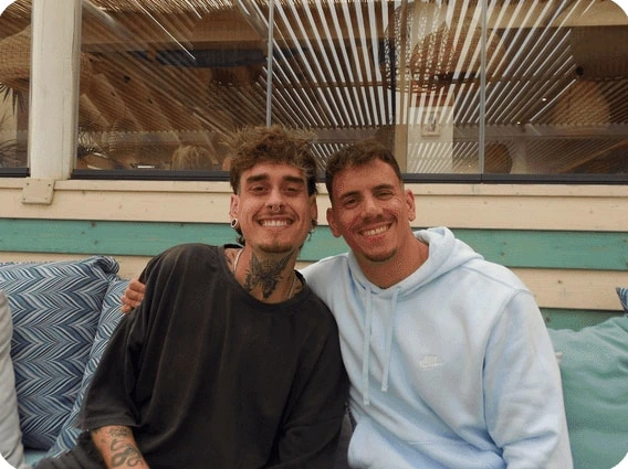The author and a friend at a table